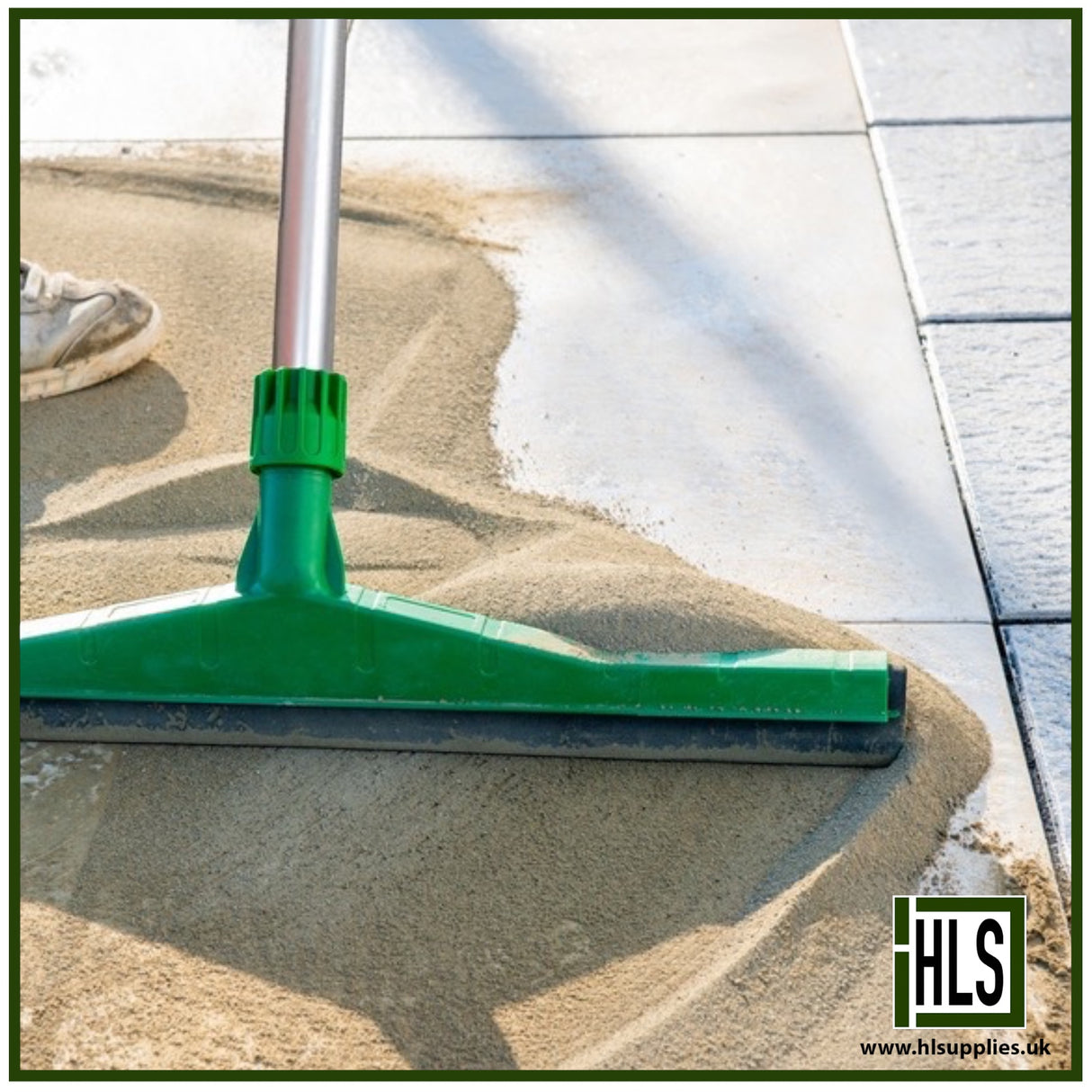 HLSupplies TuffJoint Utility brush-in grout being swept into paving joints with a green squeegee on a patio