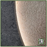 HLSupplies Coreterra porcelain paving slabs showing a textured beige surface next to a dark charcoal terrazzo-style edge