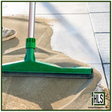 HLSupplies TuffJoint Utility brush-in grout being swept into paving joints with a green squeegee on a patio